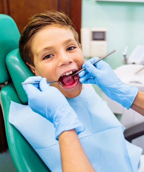 Child receiving special needs dentistry treatment