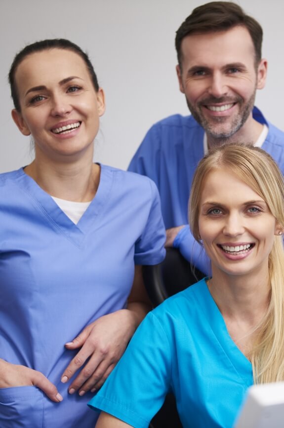 Three dental office team members