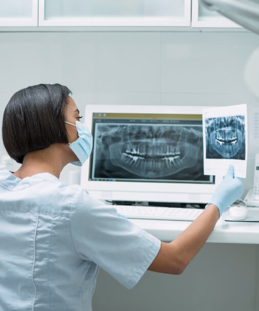 Dentist reviewing all digital x-rays