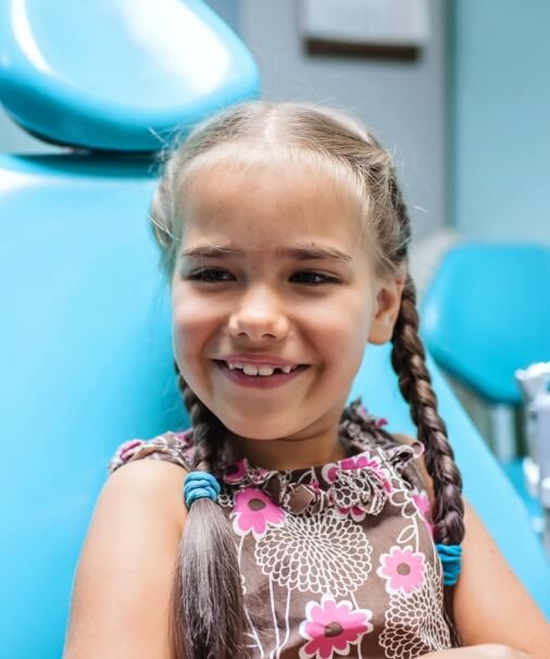 Child smiling during first dental visit