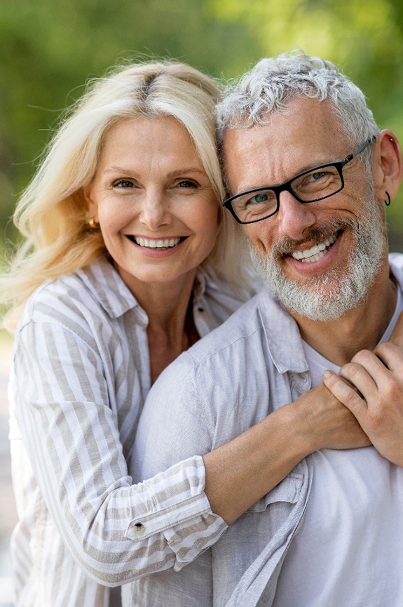 Smiling and happy couple after seeing a Cigna dentist in Newbury Park