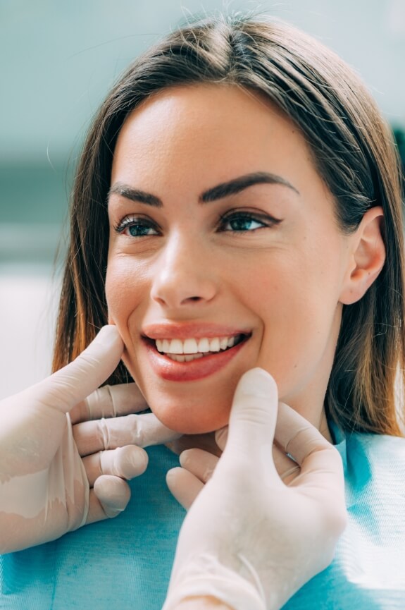 Woman with beautiful smile after cosmetic dentistry