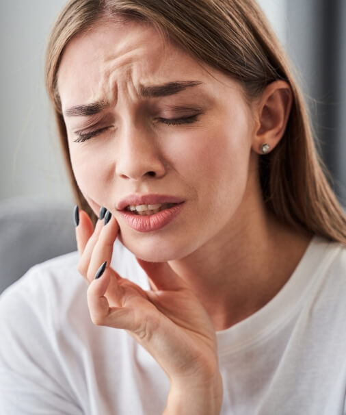 Woman in pain before emergency dentistry treatment