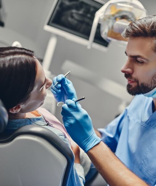 Dentist performing full mouth reconstruction