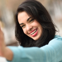 Woman smiling after Invisalign smile evaluation