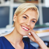 Woman with porcelain veneers sharing gorgeous smile