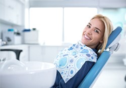Smiling woman sitting in dental office