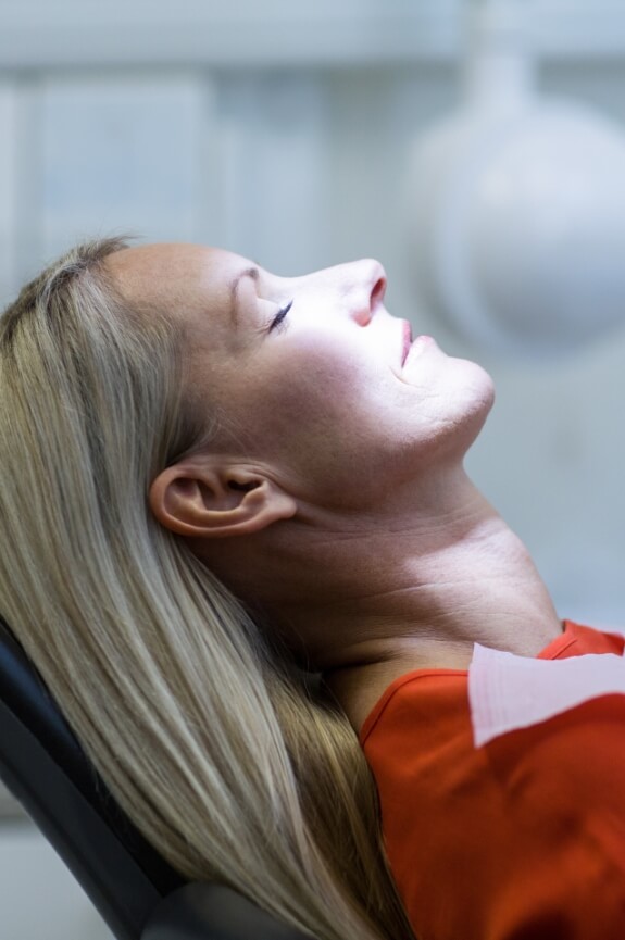 Patient relaxing during oral cancer screening
