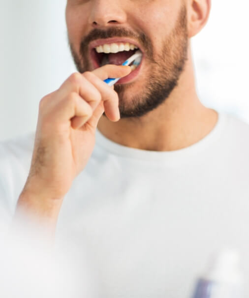 Person brushing teeth