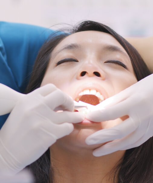 Patient receiving scaling and root planing treatment