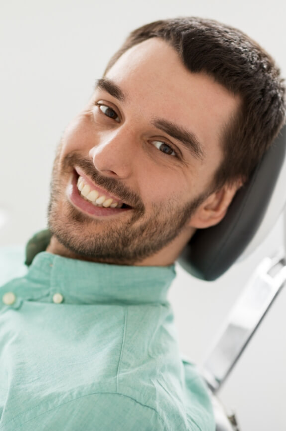 Man with healthy smile after restorative dentistry