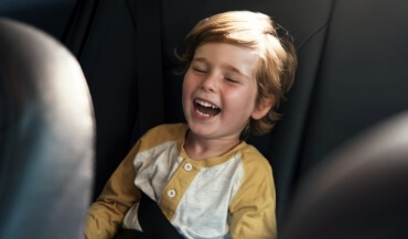 Child laughing during children's dentistry visit