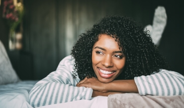 Woman with gorgeous smile after cosmetic dentistry