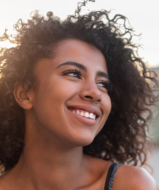 Woman smiling after visiting her Thousand Oaks dentist