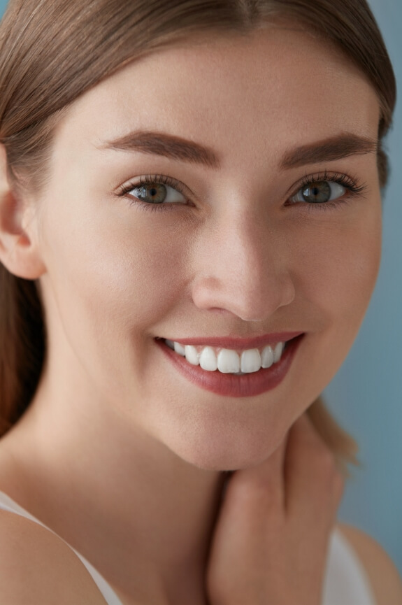 Woman with bright smile after teeth whitening