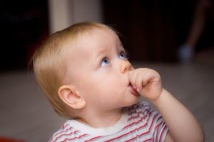 Child sucking their thumb