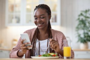 a teenager eating summer foods that are good for braces