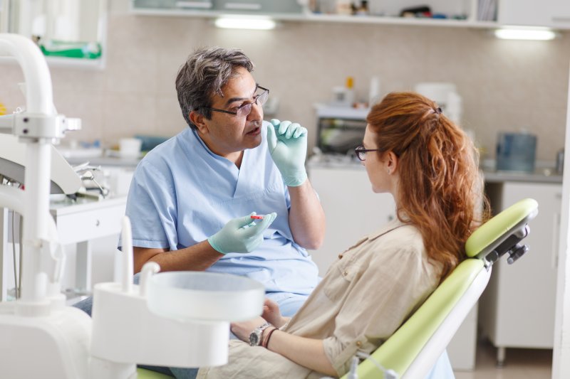 Patient talking with dentist about oral cancer